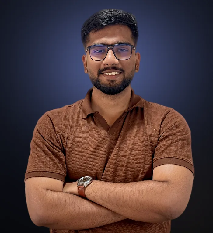 Abhinav, Lead Web Developer, smiling with arms crossed
